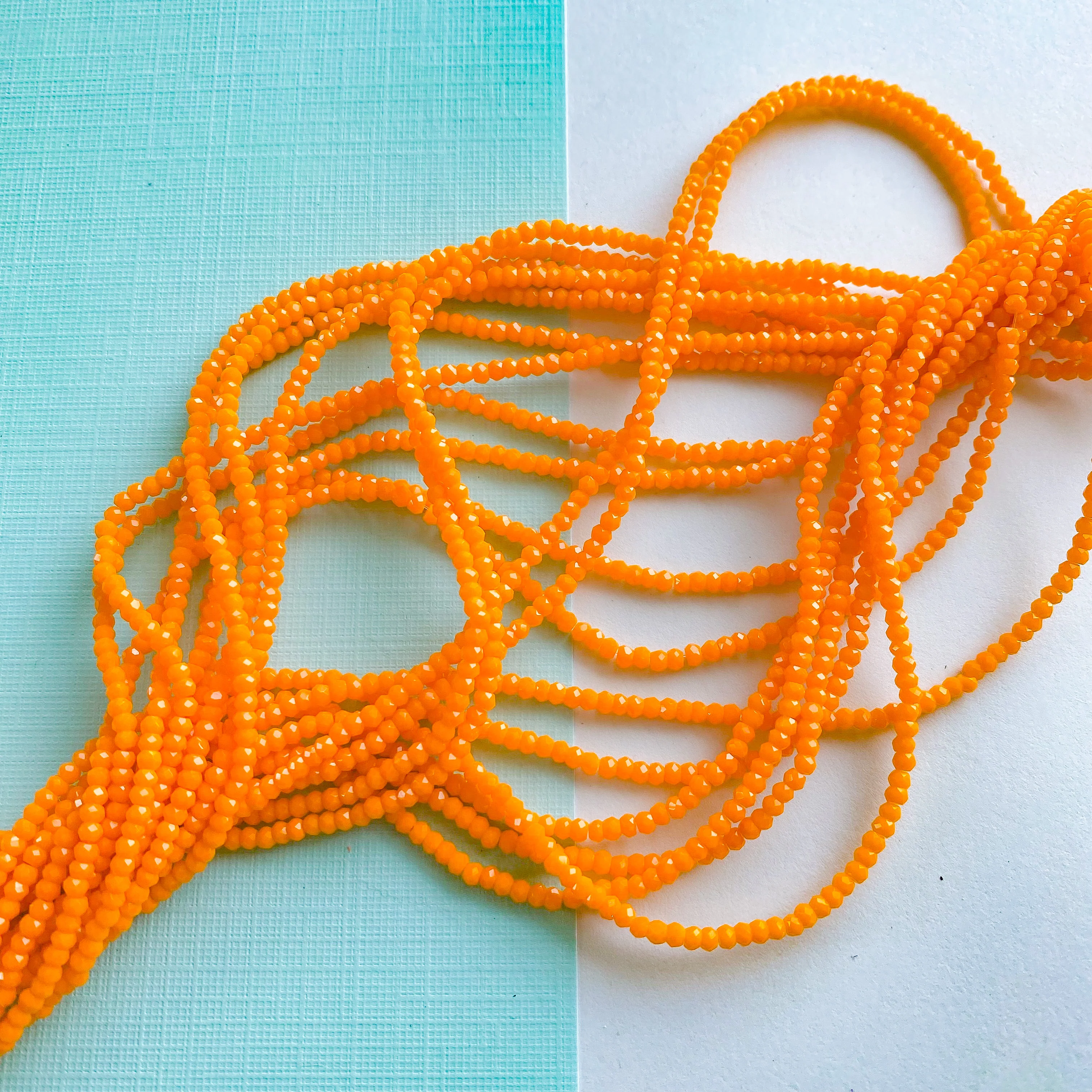 2mm Opaque Orange Faceted Crystal Strand - Image 2